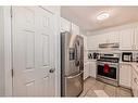 21-12 Silver Creek Boulevard Nw, Airdrie, AB  - Indoor Photo Showing Kitchen 