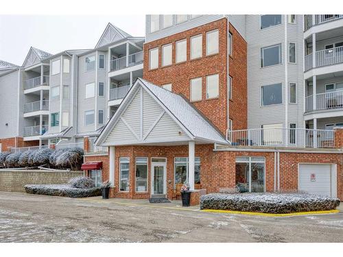 101-2101 Hawksbrow Point Nw, Calgary, AB - Outdoor With Balcony With Facade