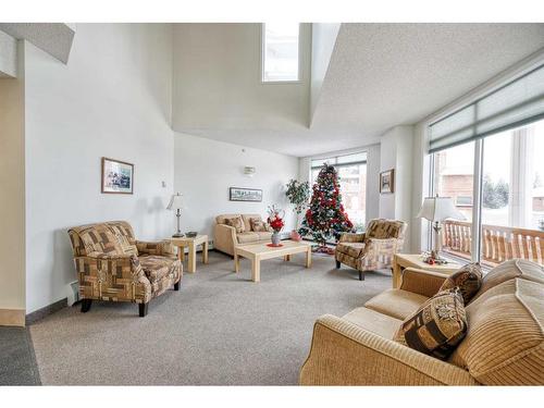 101-2101 Hawksbrow Point Nw, Calgary, AB - Indoor Photo Showing Living Room