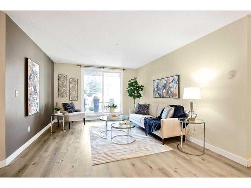 1113-4975 130 Avenue Se, Calgary, AB - Indoor Photo Showing Living Room