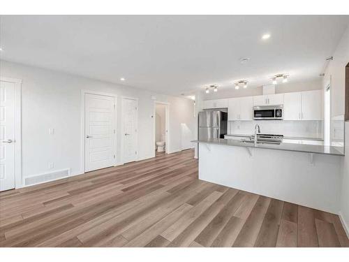 303 Cranbrook Square Se, Calgary, AB - Indoor Photo Showing Kitchen With Upgraded Kitchen