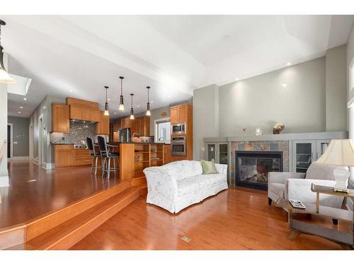 31 Aspen Meadows Green Sw, Calgary, AB - Indoor Photo Showing Living Room With Fireplace