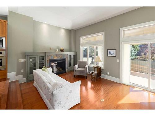 31 Aspen Meadows Green Sw, Calgary, AB - Indoor Photo Showing Living Room With Fireplace