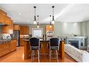 31 Aspen Meadows Green Sw, Calgary, AB  - Indoor Photo Showing Kitchen With Fireplace 