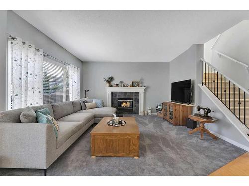 161 West Creek Boulevard, Chestermere, AB - Indoor Photo Showing Living Room With Fireplace