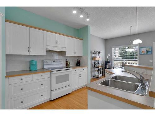 161 West Creek Boulevard, Chestermere, AB - Indoor Photo Showing Kitchen With Double Sink