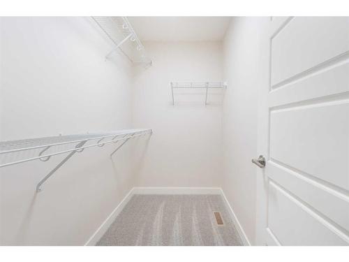 1199 Lanark Boulevard, Airdrie, AB - Indoor With Storage