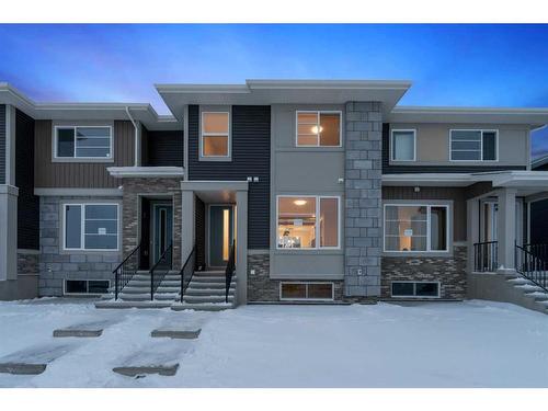 1199 Lanark Boulevard, Airdrie, AB - Outdoor With Facade