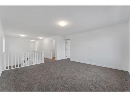 242 Baneberry Way Sw, Airdrie, AB - Indoor Photo Showing Other Room