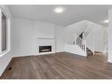 242 Baneberry Way Sw, Airdrie, AB  - Indoor Photo Showing Living Room With Fireplace 