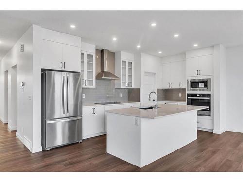 242 Baneberry Way Sw, Airdrie, AB - Indoor Photo Showing Kitchen With Upgraded Kitchen