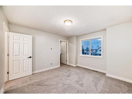 209 Evansmeade Close Nw, Calgary, AB - Indoor Photo Showing Other Room