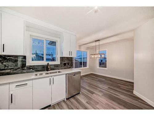 209 Evansmeade Close Nw, Calgary, AB - Indoor Photo Showing Kitchen With Double Sink