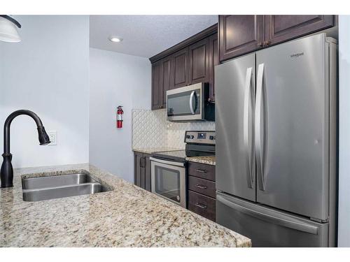 19654 42 Street Se, Calgary, AB - Indoor Photo Showing Kitchen With Stainless Steel Kitchen With Double Sink With Upgraded Kitchen