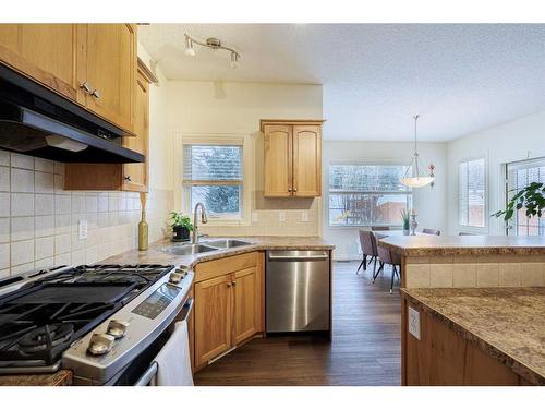 66 Tuscany Ridge Close Nw, Calgary, AB - Indoor Photo Showing Kitchen With Double Sink