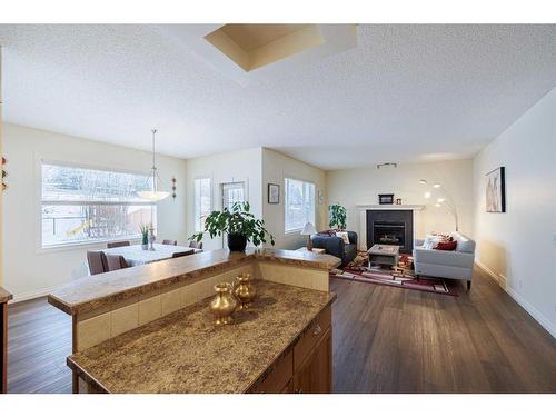 66 Tuscany Ridge Close Nw, Calgary, AB - Indoor Photo Showing Living Room With Fireplace