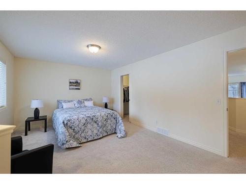 66 Tuscany Ridge Close Nw, Calgary, AB - Indoor Photo Showing Bedroom