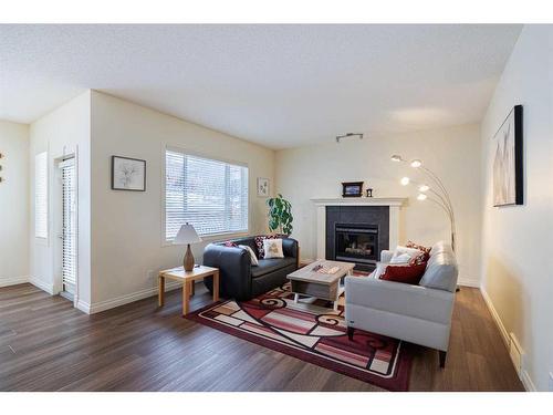 66 Tuscany Ridge Close Nw, Calgary, AB - Indoor Photo Showing Living Room With Fireplace