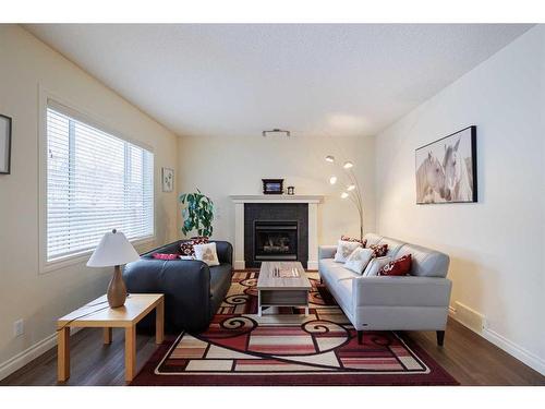 66 Tuscany Ridge Close Nw, Calgary, AB - Indoor Photo Showing Living Room With Fireplace