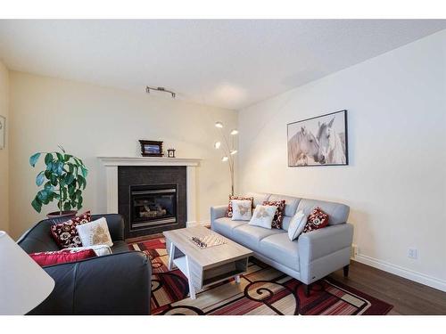 66 Tuscany Ridge Close Nw, Calgary, AB - Indoor Photo Showing Living Room With Fireplace