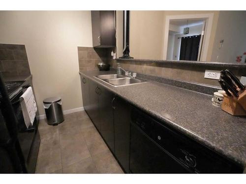 1314-604 East Lake Boulevard Ne, Airdrie, AB - Indoor Photo Showing Kitchen With Double Sink