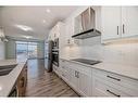 412-30 Sage Hill Nw, Calgary, AB  - Indoor Photo Showing Kitchen With Double Sink With Upgraded Kitchen 