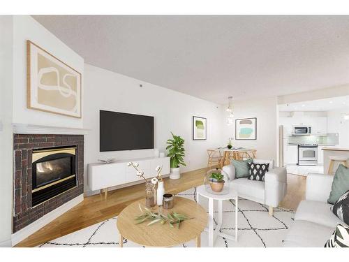 102-820 15 Avenue Sw, Calgary, AB - Indoor Photo Showing Living Room With Fireplace