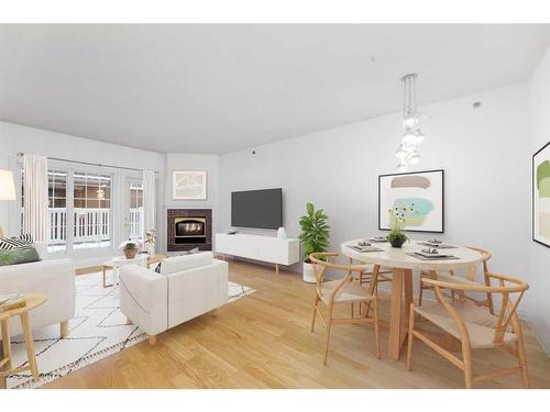 102-820 15 Avenue Sw, Calgary, AB - Indoor Photo Showing Living Room With Fireplace