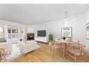 102-820 15 Avenue Sw, Calgary, AB  - Indoor Photo Showing Living Room With Fireplace 