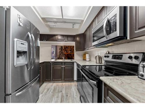 202-1625 14 Avenue Sw, Calgary, AB - Indoor Photo Showing Kitchen With Stainless Steel Kitchen With Upgraded Kitchen