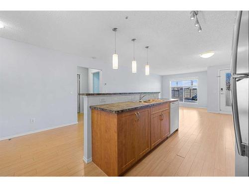 2105-700 Willowbrook Road Nw, Airdrie, AB - Indoor Photo Showing Kitchen With Double Sink