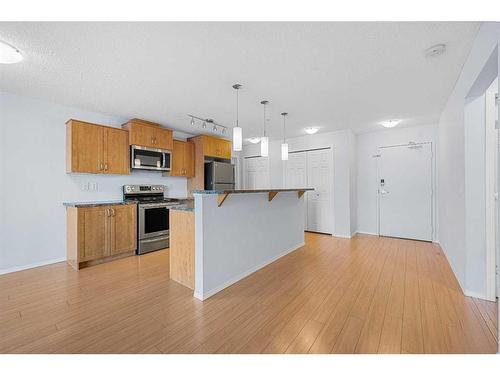 2105-700 Willowbrook Road Nw, Airdrie, AB - Indoor Photo Showing Kitchen