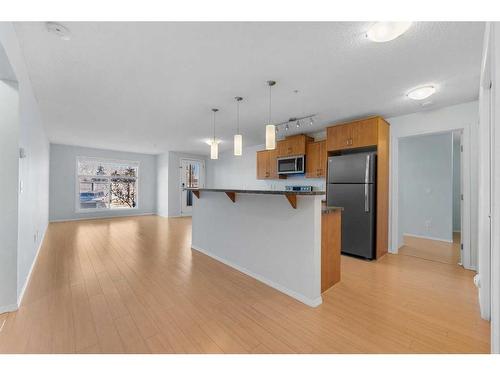 2105-700 Willowbrook Road Nw, Airdrie, AB - Indoor Photo Showing Kitchen