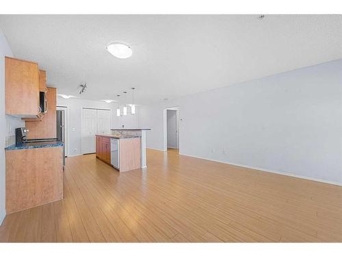 2105-700 Willowbrook Road Nw, Airdrie, AB - Indoor Photo Showing Kitchen