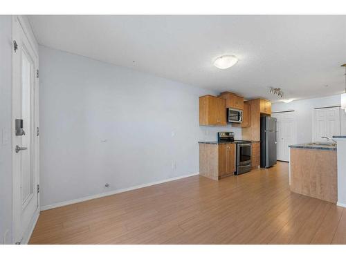 2105-700 Willowbrook Road Nw, Airdrie, AB - Indoor Photo Showing Kitchen