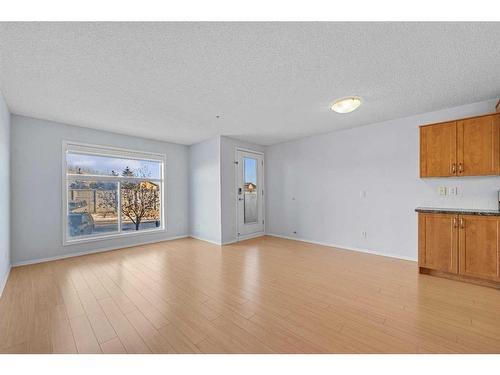 2105-700 Willowbrook Road Nw, Airdrie, AB - Indoor Photo Showing Living Room