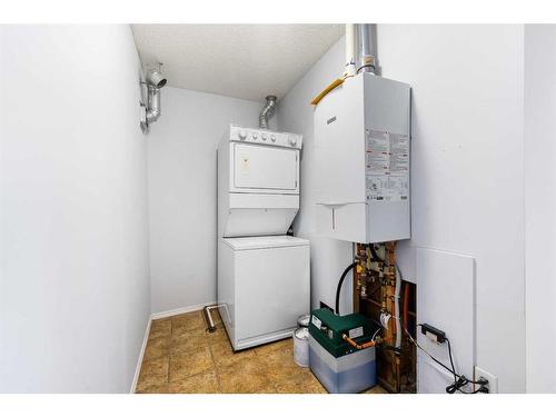 2105-700 Willowbrook Road Nw, Airdrie, AB - Indoor Photo Showing Laundry Room