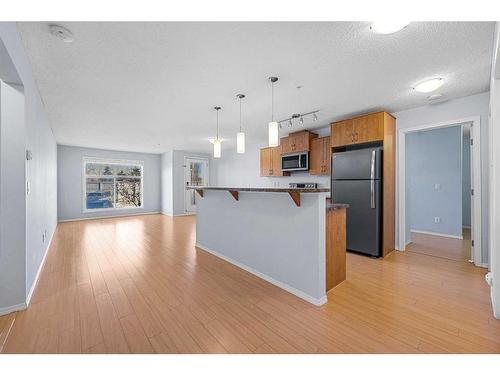 2105-700 Willowbrook Road Nw, Airdrie, AB - Indoor Photo Showing Kitchen