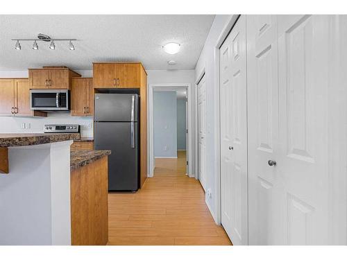 2105-700 Willowbrook Road Nw, Airdrie, AB - Indoor Photo Showing Kitchen