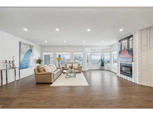 108 Patterson Drive Sw, Calgary, AB - Indoor Photo Showing Living Room With Fireplace