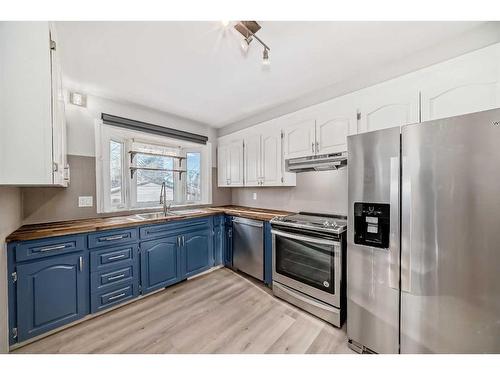 327 Avonburn Road Se, Calgary, AB - Indoor Photo Showing Kitchen With Stainless Steel Kitchen With Double Sink