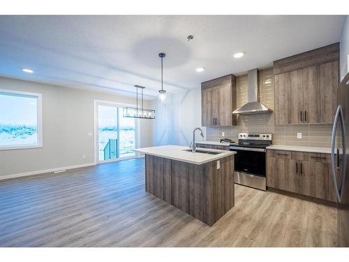 94 Finch Gardens Se, Calgary, AB - Indoor Photo Showing Kitchen With Stainless Steel Kitchen With Double Sink With Upgraded Kitchen