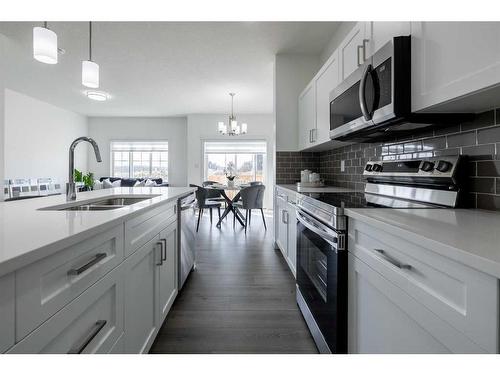 3093 Key Drive Sw, Airdrie, AB - Indoor Photo Showing Kitchen With Double Sink With Upgraded Kitchen