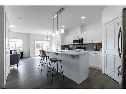 3093 Key Drive Sw, Airdrie, AB - Indoor Photo Showing Kitchen With Upgraded Kitchen