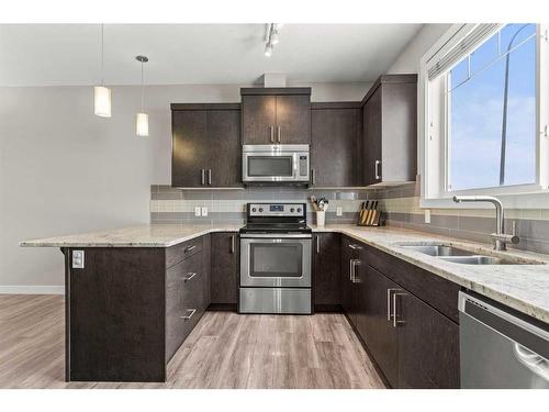 1545 Symons Valley Parkway Nw, Calgary, AB - Indoor Photo Showing Kitchen With Stainless Steel Kitchen With Double Sink With Upgraded Kitchen