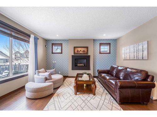 624 Quarry Way Se, Calgary, AB - Indoor Photo Showing Living Room With Fireplace