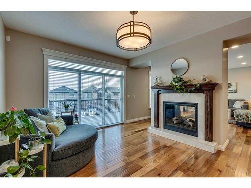 151 Auburn Sound Circle Se, Calgary, AB - Indoor Photo Showing Living Room With Fireplace