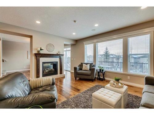 151 Auburn Sound Circle Se, Calgary, AB - Indoor Photo Showing Living Room With Fireplace