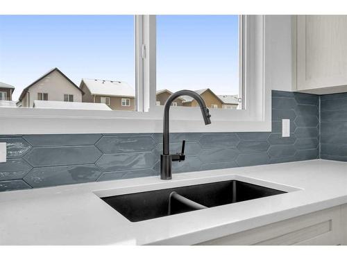 631 Rangeview Street Se, Calgary, AB - Indoor Photo Showing Kitchen With Double Sink