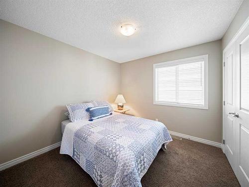 12 Sage Bank Road Nw, Calgary, AB - Indoor Photo Showing Bedroom